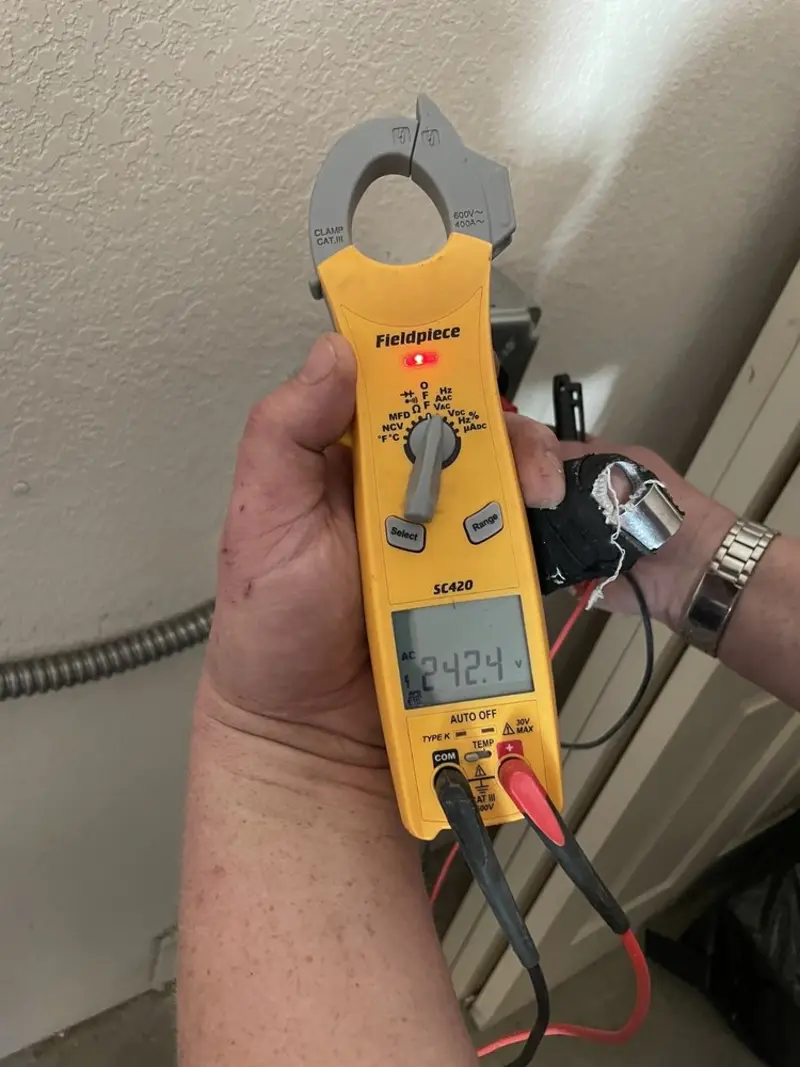 Voltage testing with clamp meter during Whole House Surge Protector in East Hempfield
